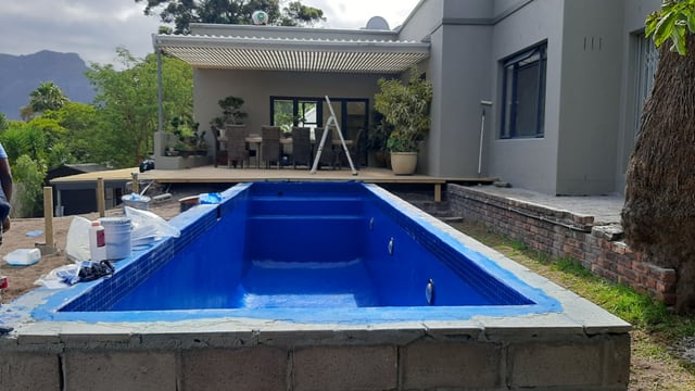 Re-surfaced pool beneath the mountain